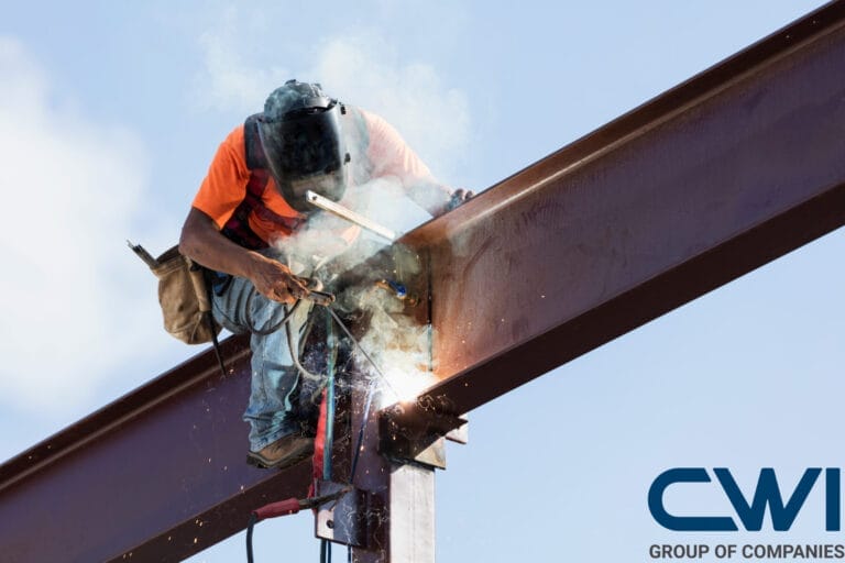 Man welding on an elevated structure